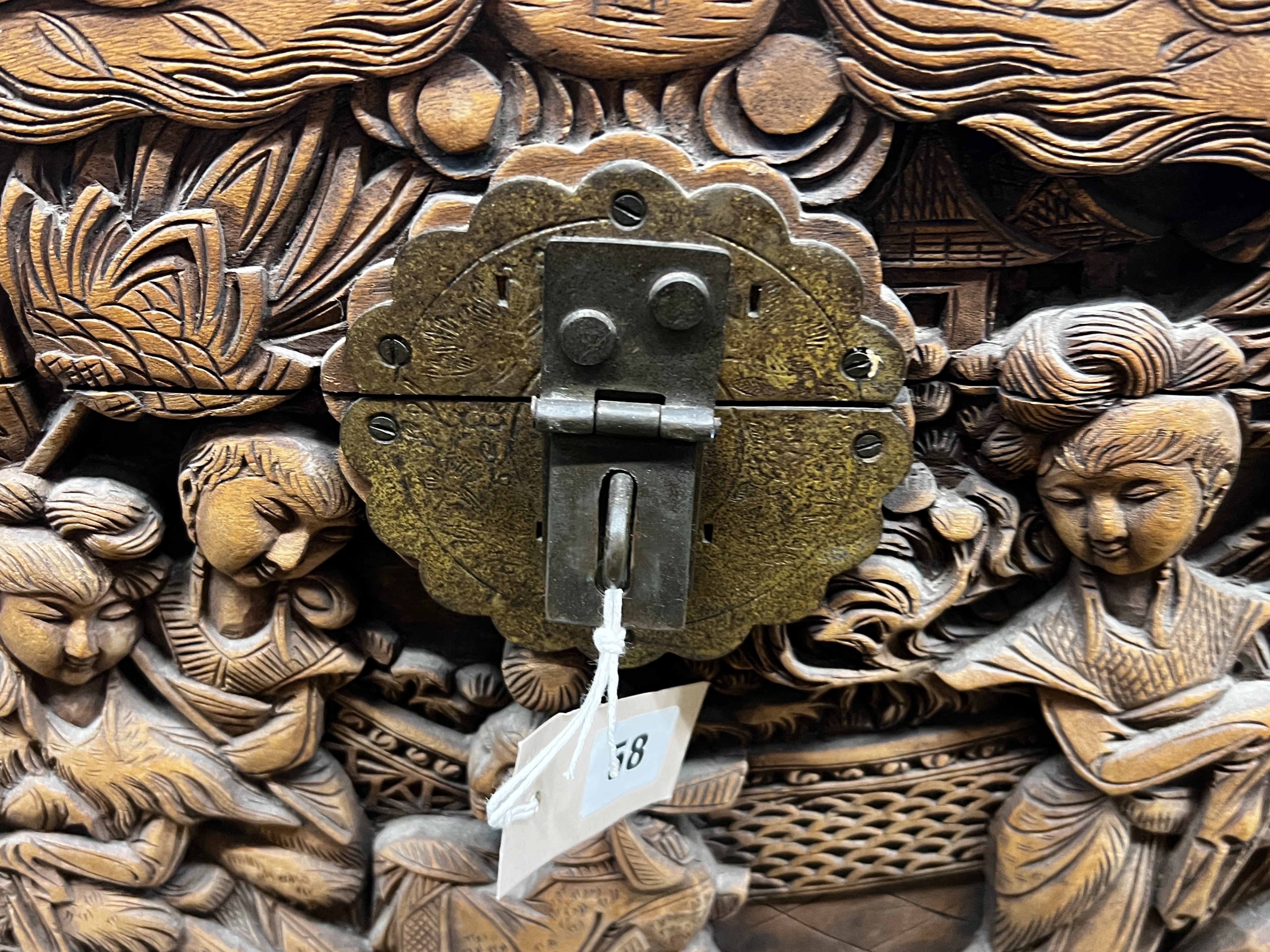 A Chinese carved camphorwood trunk, length 104cm, depth 52cm, height 61cm